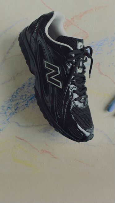 One black 204L shoe in studio.